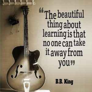 Image showing a photograph of a guitar and a quote from BB King n a website for guitar lessons