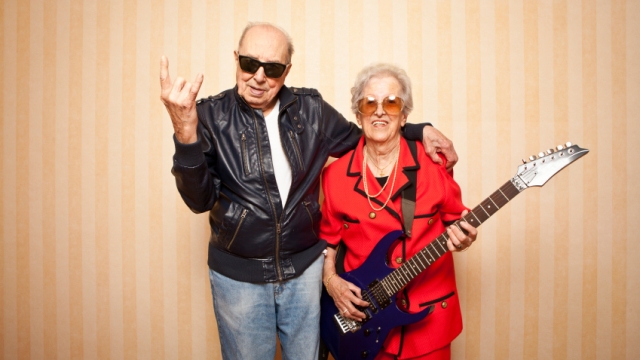 Image showing photograph of an old man and woman rocking with a guitar.